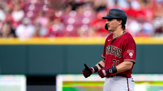 Jake McCarthy (31) gives his teammates the thumbs up after hitting a double against the Cincinnati Reds.